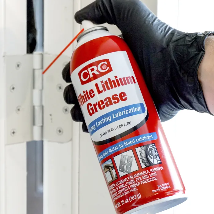 white lithium grease applied to mortise lock pivot points and deadbolt track